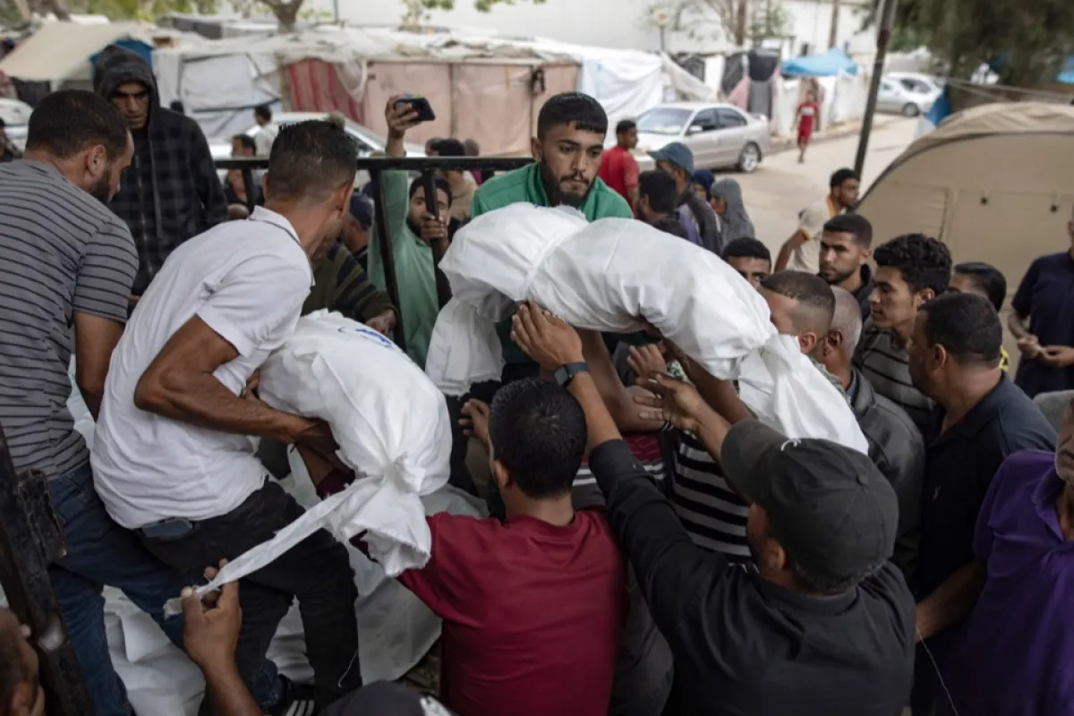 Palestinians in Khan Yunis mourn their dead after Israeli strike