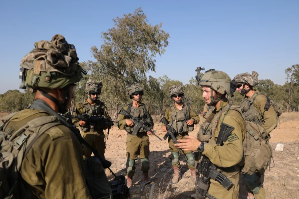 Israeli troops gather near the Gaza border, southern Israel