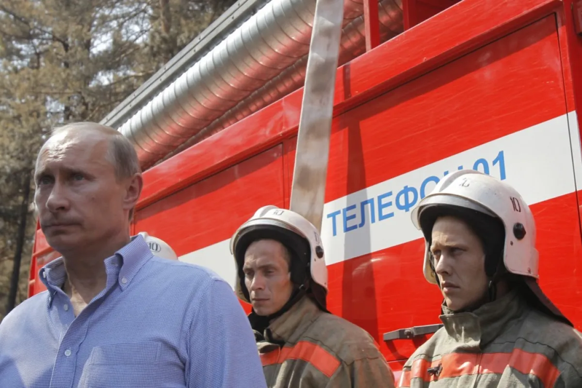 Russian Prime Minister Vladimir Putin walks to meet freighters near the city of Voronezh