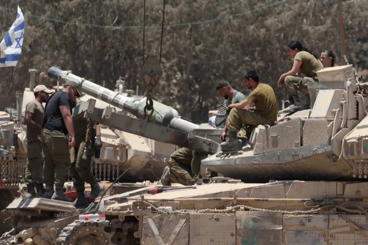 Israeli troops gather near the Gaza border, southern Israel