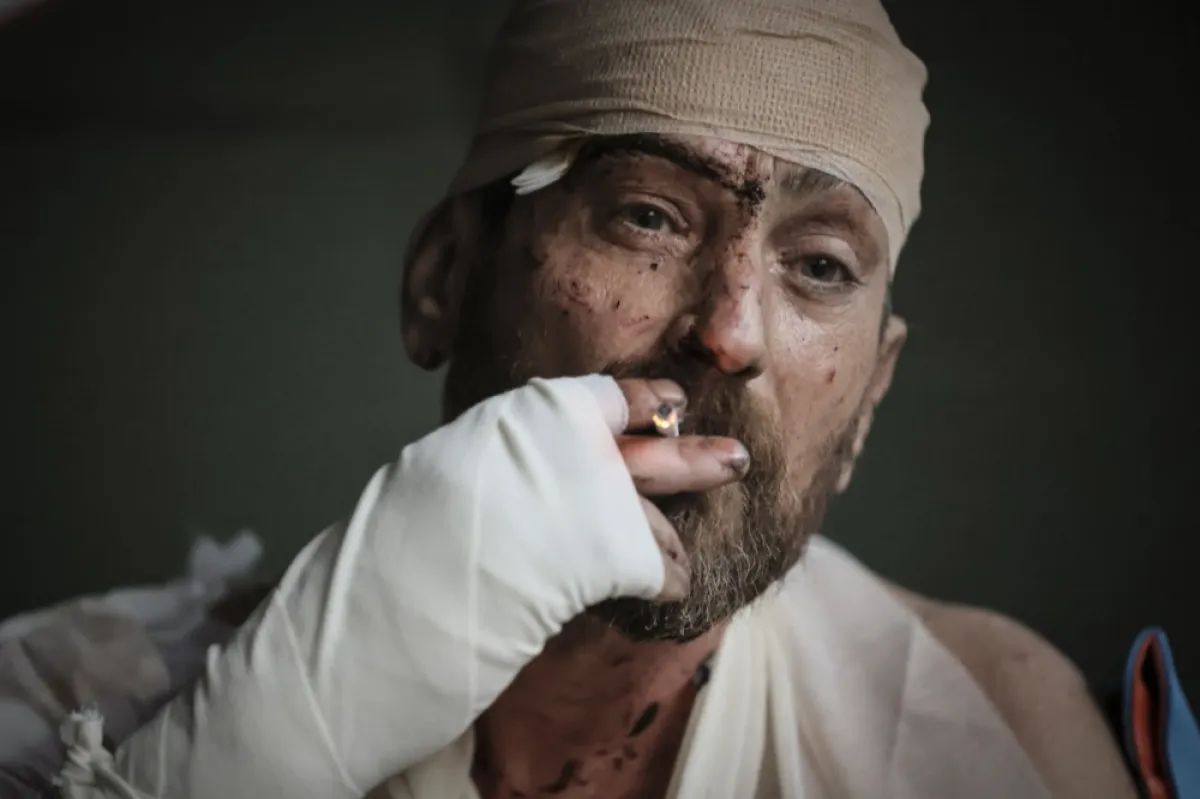 Injured Ukrainian servicemen receiving medical treatment near the front line in the Donetsk region