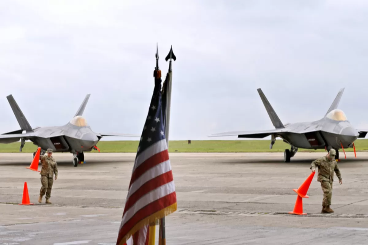 Romanian and US national flags in between two F22 Raptor jet of the US Air Force that landed at the Mijhail Kogalniceanu military airbase, near the Black Sea, at 250 kilometers south-east of Bucharest.