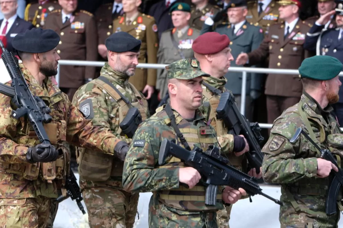 Servicemen of NATO enhanced Forward Presence Battle Group Latvia attend the military parade during the celebration of the 32nd anniversary of the restoration of independence of Latvia, in Saldus, Latvia, 04 May 2022.