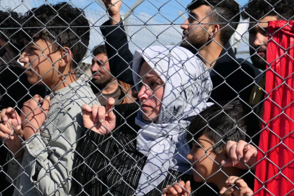 migranți