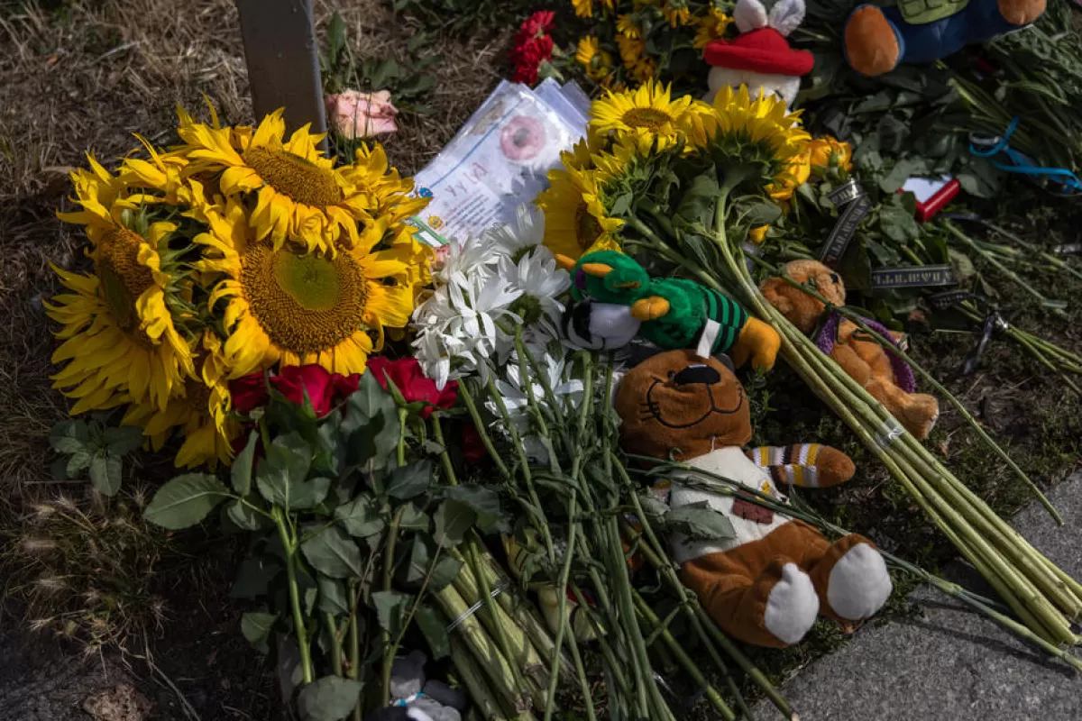 Floral tributes placed at the site the day after a Russian missile strike in downtown Vinnytsia, Ukraine, 15 July 2022.