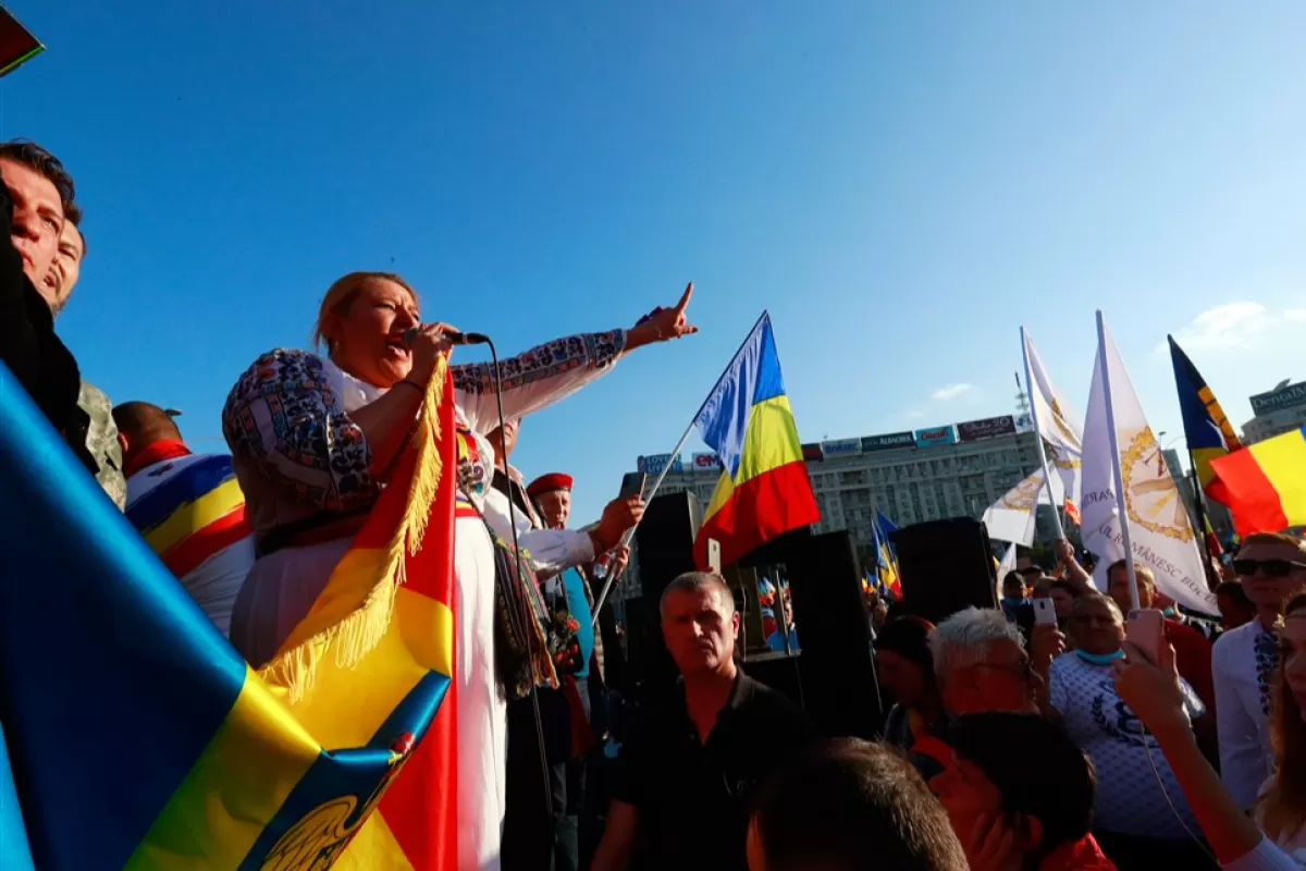 Diana Sosoaca, member of the Romanian Parliament, shouts slogans during a protest against new measures ordered by the Romanian government during the fourth wave of the Covid-19 Coronavirus pandemic, in front of government headquarters in Bucharest, Romania, 02 October 2021. 