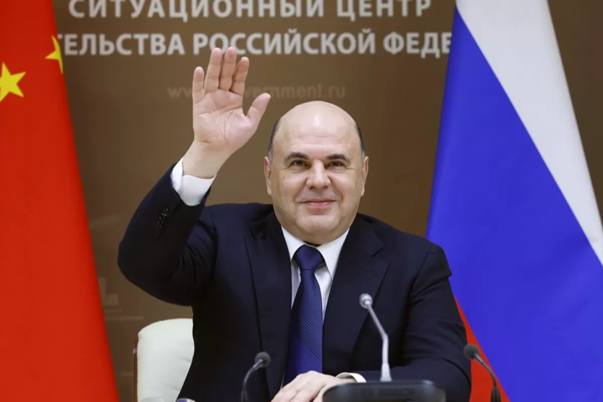 Russian Prime Minister Mikhail Mishustin attends a meeting with Chinese State Council Premier Li Keqiang via a video conference