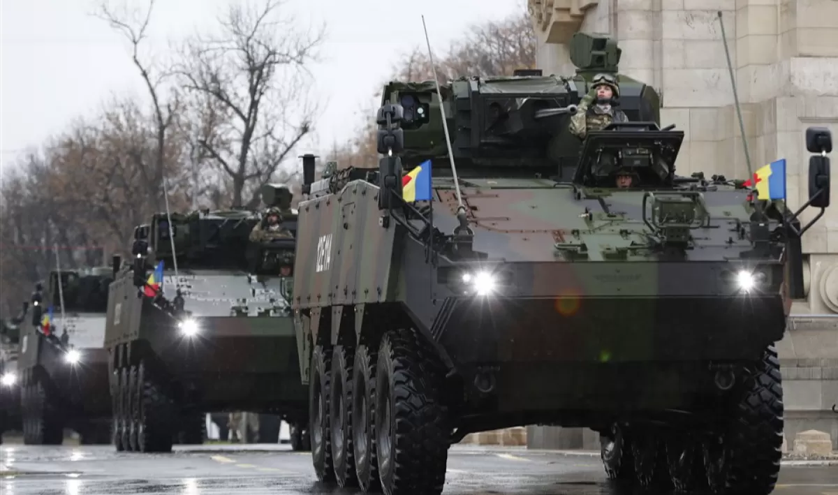 Romanian army Piranha V Infantry Fighting Vehicles pass under the Triumph Arch during a military parade organized to mark Romania's Great Union Day, in Bucharest, Romania, 01 December 2022.