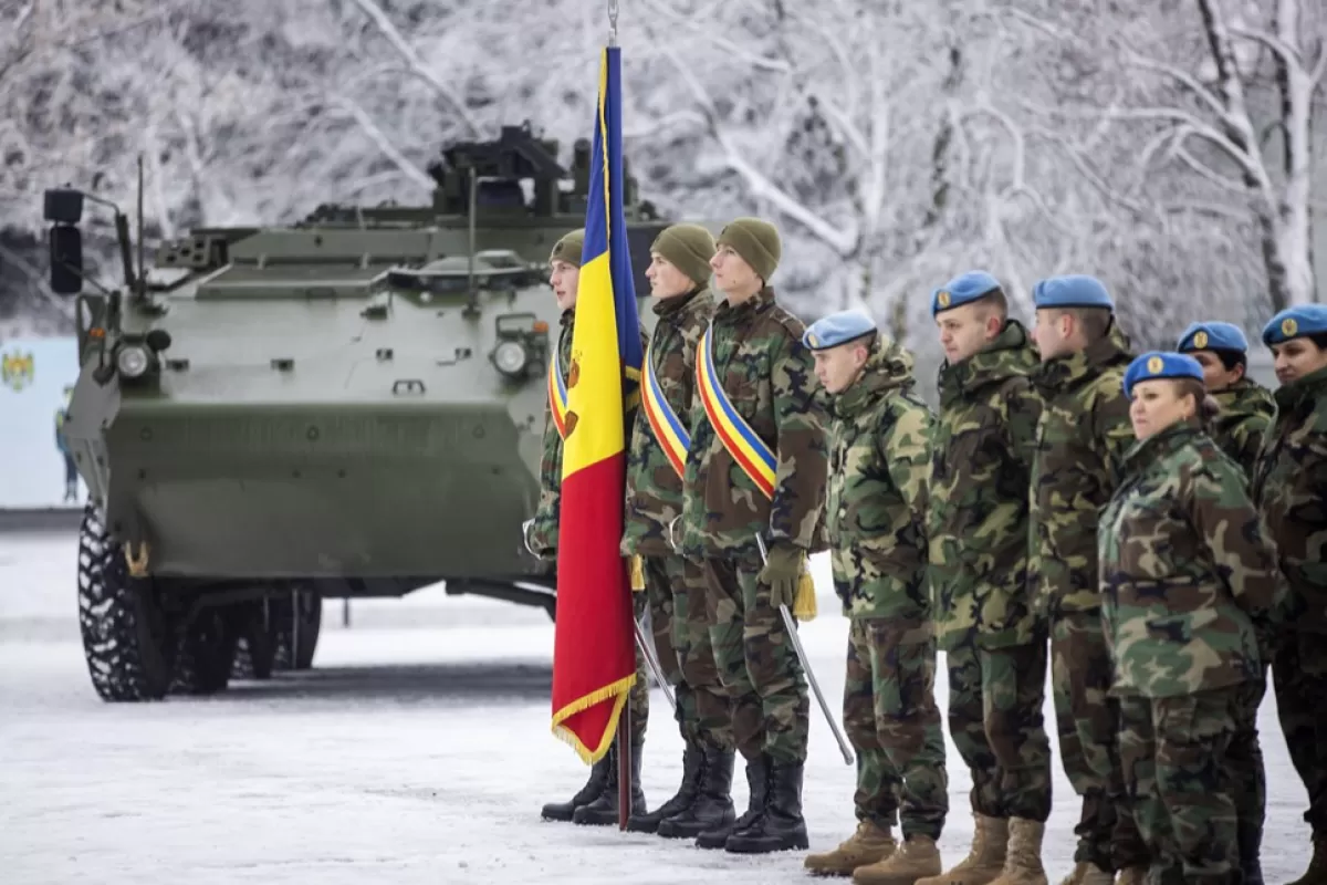Soldiers stand at attention during the official ceremony of receiving 'Piranha-3 H' transporters military vehicles at the Military Camp 142 in Chisinau, Moldova, 12 January 2023.