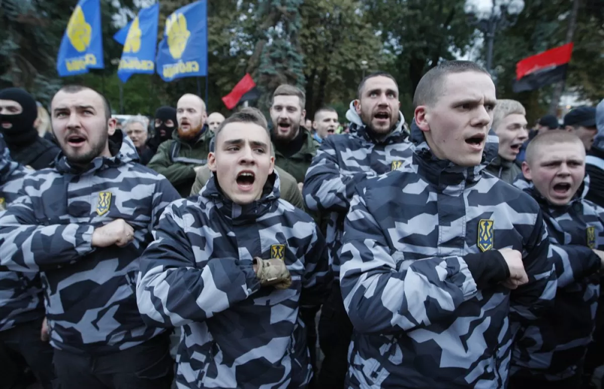 Ukrainian far-right activists chant slogans in front of the Ukrainian Parliament during a parliamentary session, in Kiev, Ukraine, 05 October 2017.