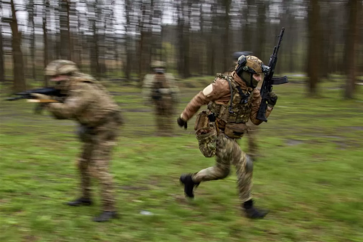 Members of the newly formed 'Spartan' brigade take part in military training on a shooting range near Kharkiv, northeastern Ukraine, 20 April 2023, amid the Russian invasion.