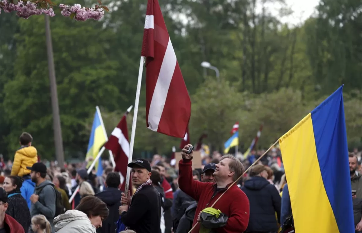 People attend the march 'On getting rid of the Soviet heritage' in Riga, Latvia, 20 May 2022.