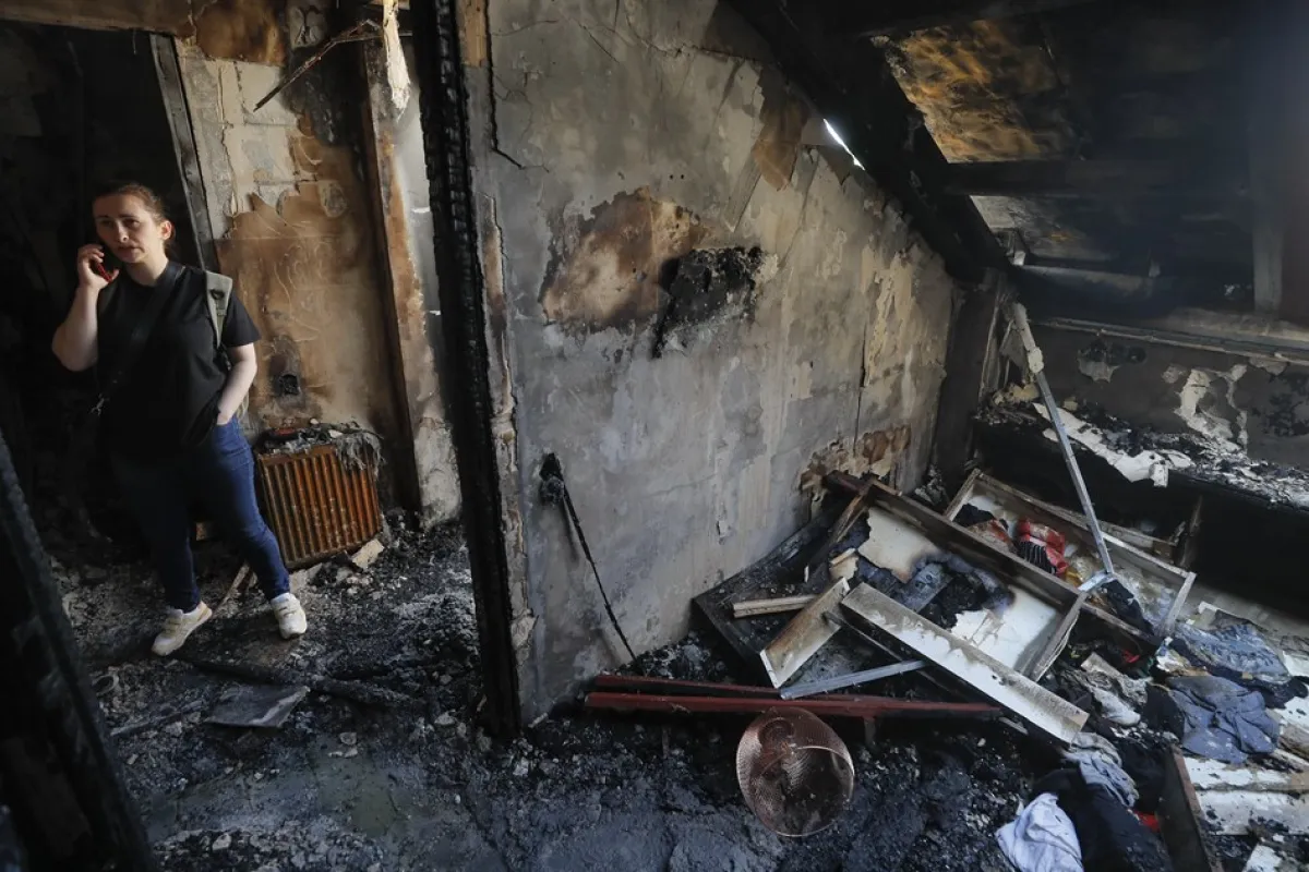 Debris from Russian drone attack on Kyiv damages residential area