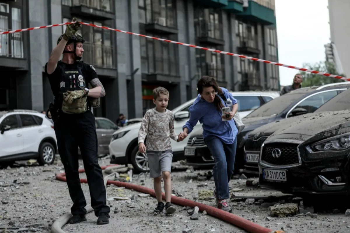 At least three killed as rocket fragments hit high-rise building in Kyiv
