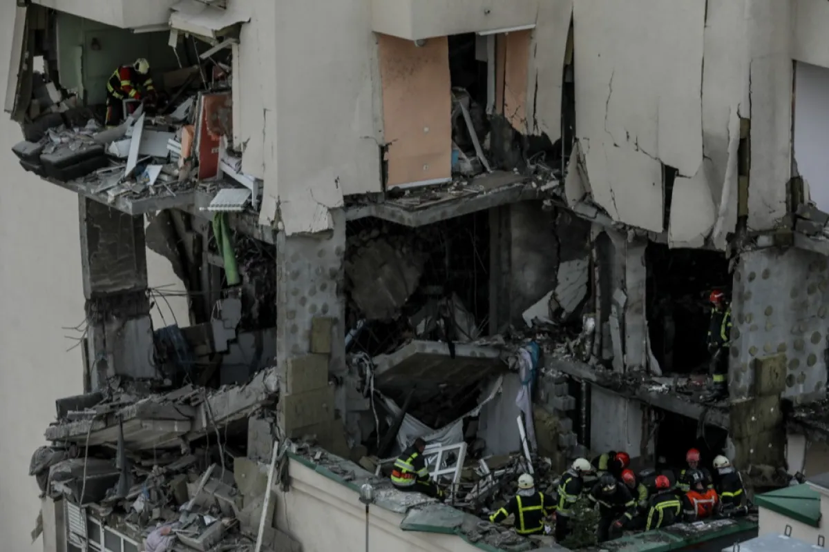 At least three killed as rocket fragments hit high-rise building in Kyiv