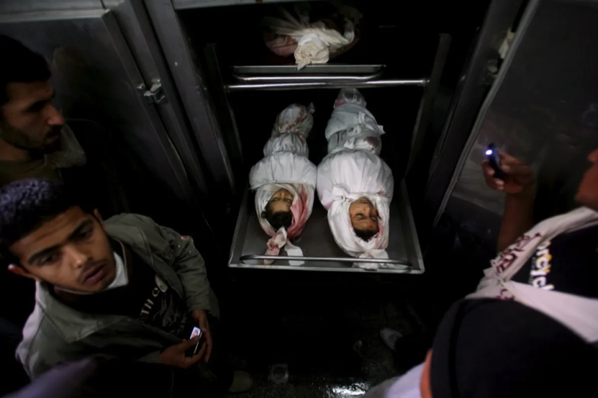 The corpses of two children of the Abu Eita family who were killed in their house following an Israeli strike