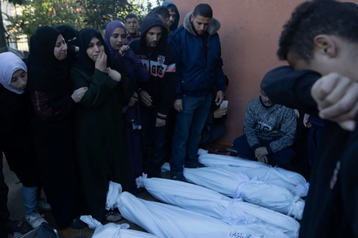 Palestinians mourn their dead as Israel continues to strike Gaza