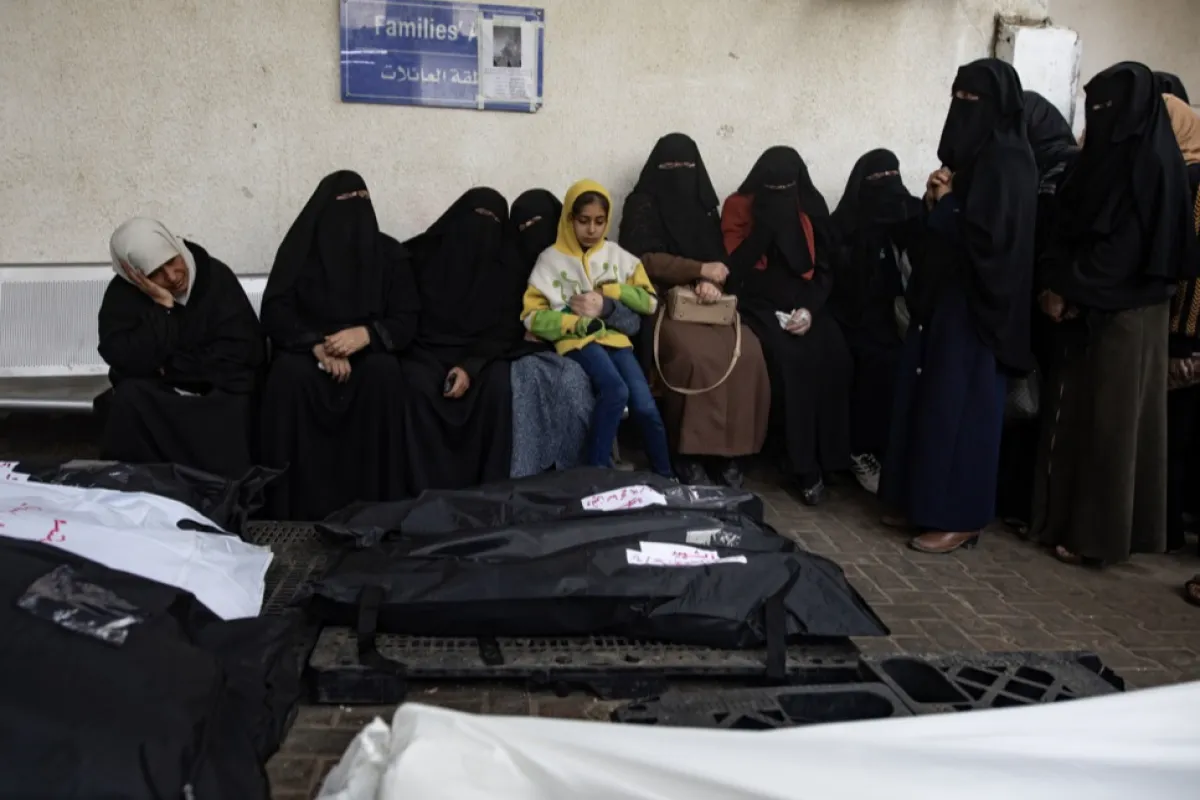 Palestinians mourn their dead following Israeli strike on Rafah camp