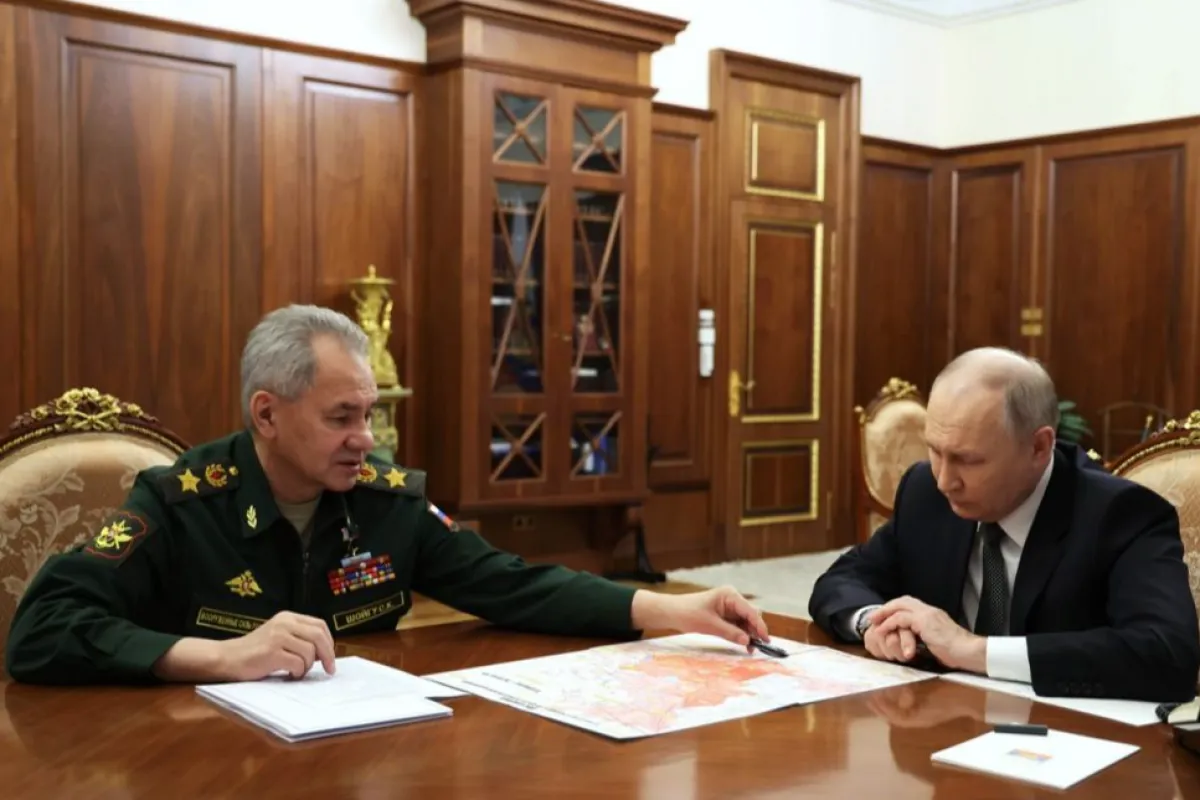 Russian President Vladimir Putin meets with Russian Defence Minister Sergei Shoigu