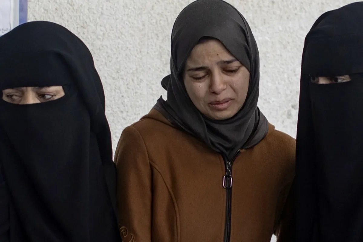 Palestinians mourn their dead after Israeli airstrikes on Rafah, southern Gaza Strip