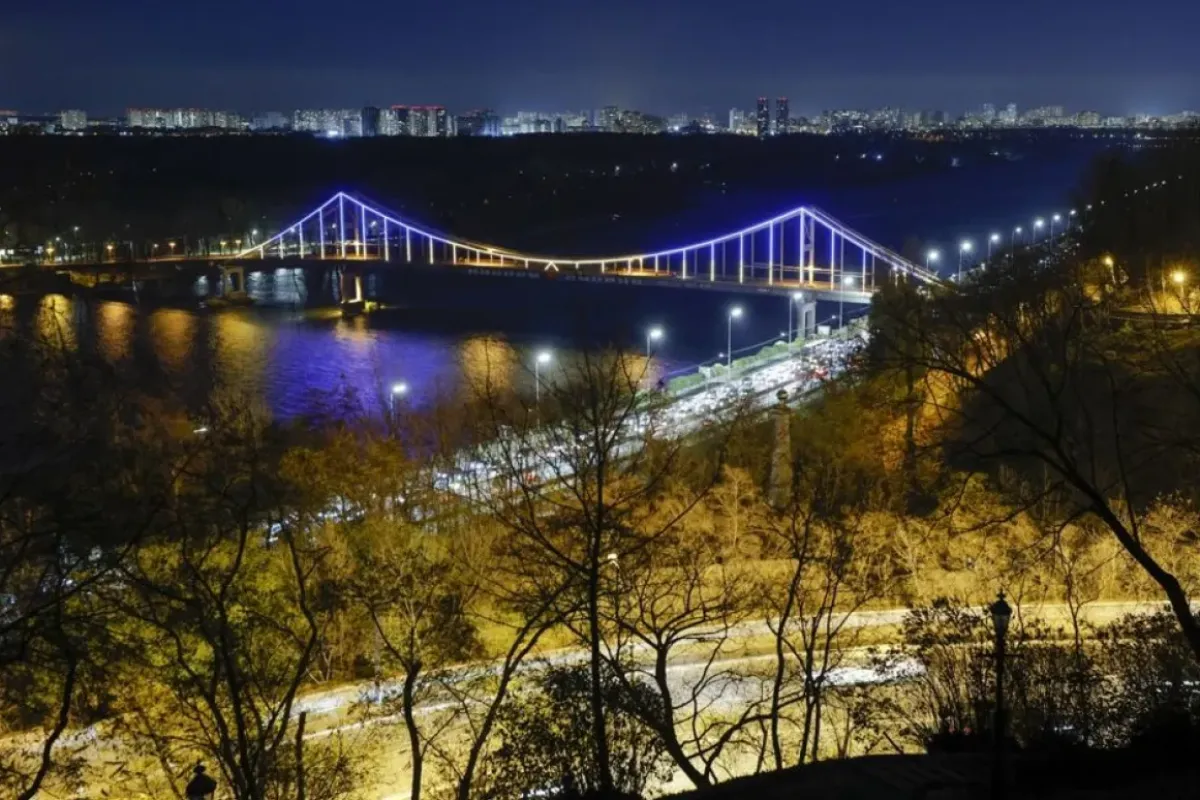 The Parkovyi Bridge spanning the Dnieper River is illuminated at night in Kiev, Ukraine, November 10, 2023, amid the Russian invasion.