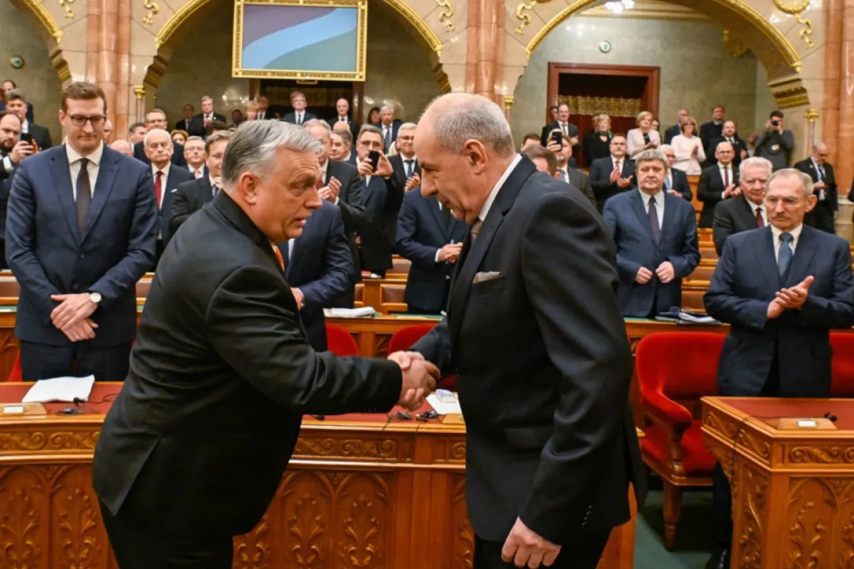 Tamas Sulyok, the Fidesz-KDNP candidate for head of state, (R) is congratulated by Hungarian Prime Minister Viktor Orban after Hungarian lawmakers elected him as president during the extraordinary session of the Hungarian parliament in Budapest, Hungary, 26 February 2024.