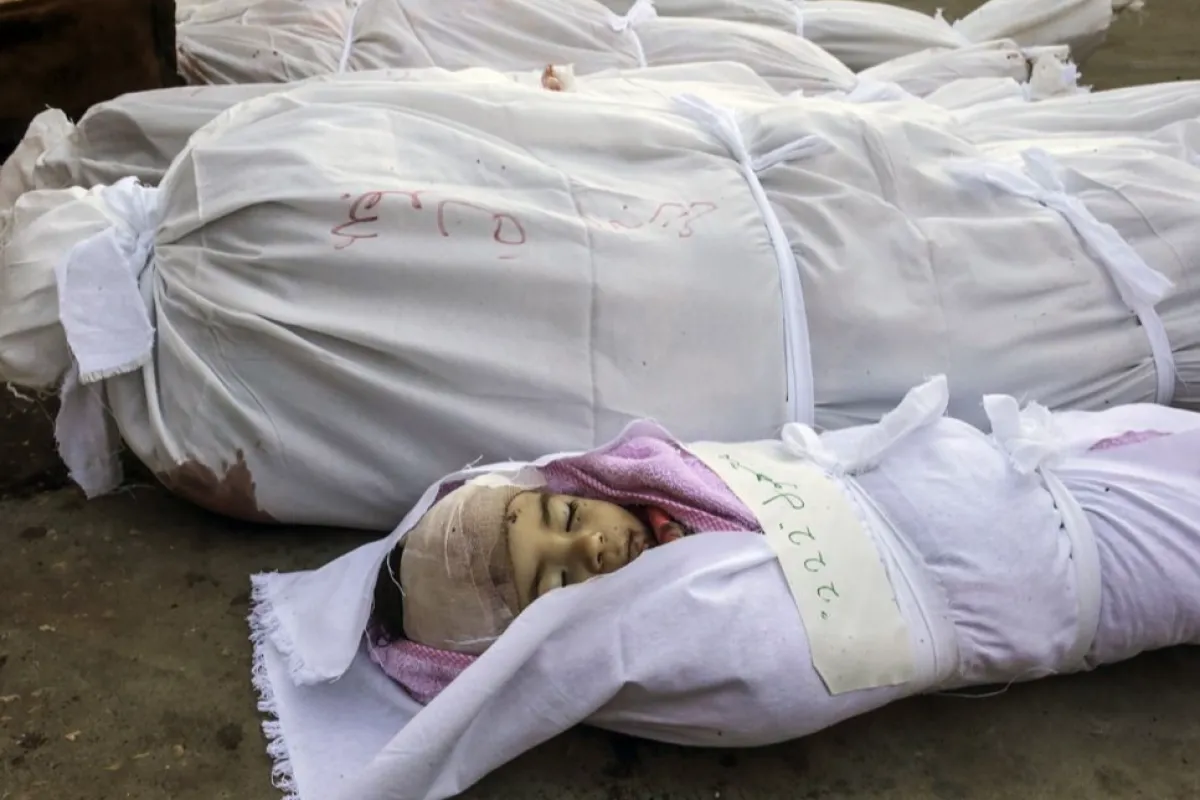 Palestinians mourn their dead after strike at Al Nusairat refugee camp