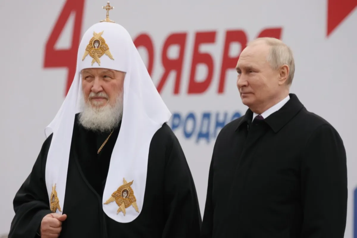 Russian President Vladimir Putin (R) and Patriarch Kirill of Moscow and all Russia attend a flower-laying ceremony at the monument to Citizen Kuzma Minin and Prince Dmitry Pozharsky on the National Unity Day in Red Square, in Moscow, Russia, 04 November 2023.