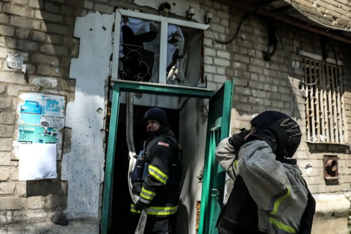 Ukrainian firefighters in action after artillery strike in the region of Donetsk
